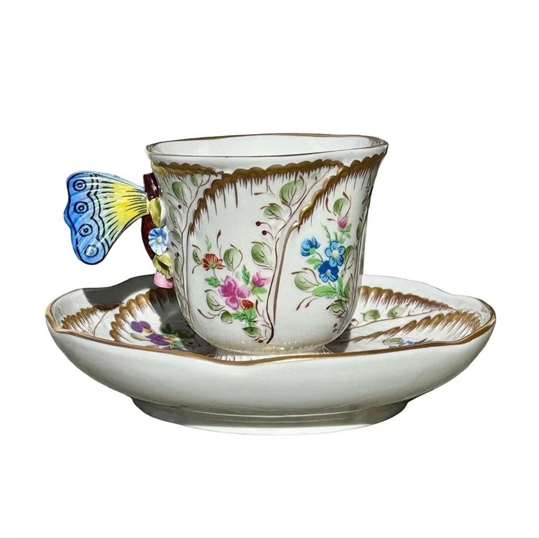 Sevres Butterfly Cup & Saucer: French Sevres porcelain butterfly handle cup and saucer with hand-painted decoration and applied porcelain butterfly in blue, yellow, and gold tones. Marked on underside.