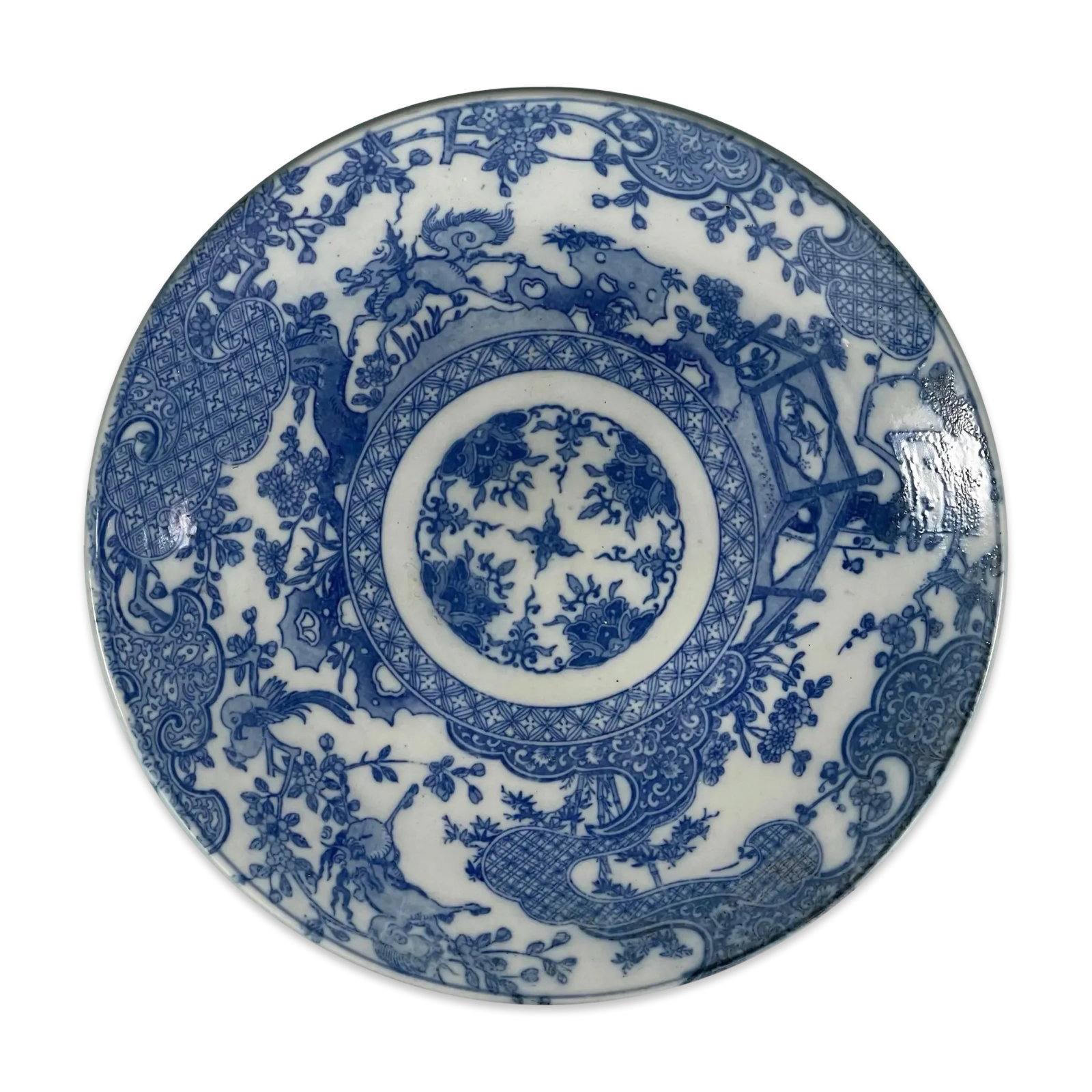 Japanese Arita Imari Charger Plate: Antique Japanese Arita Imari porcelain charger plate with Qilin (Kirin), geometric Kraak-style panels and traditional motifs. Stand not included Approx. Dimensions: 1.5H x 12W x 12D inches