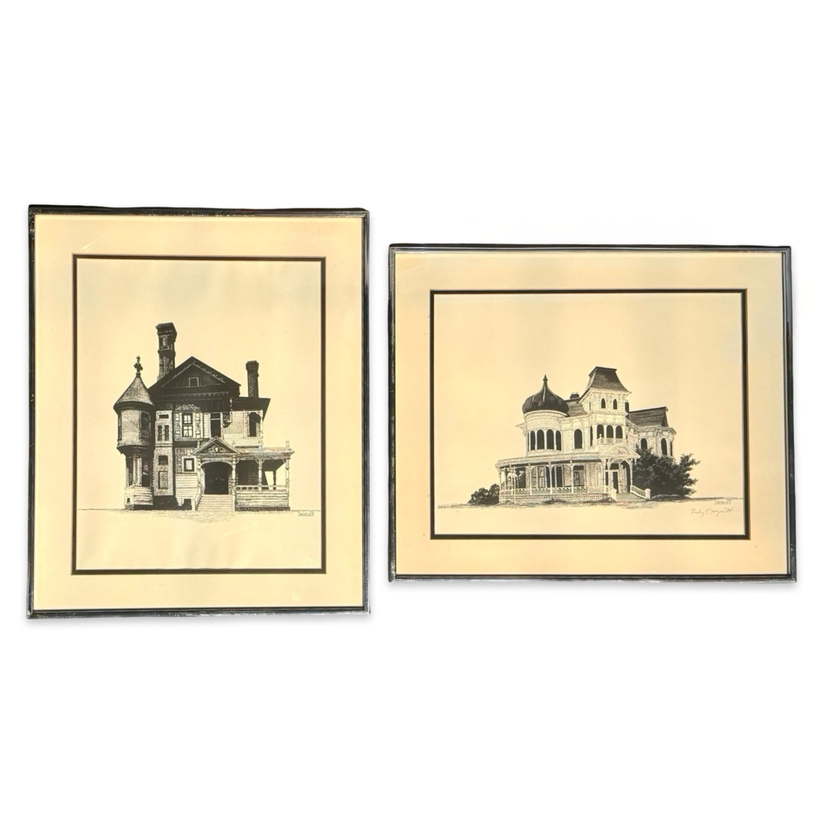 Droguett Architectural Prints Pair: Vintage Rudy Droguett architectural prints pair of Victorian homes. Signed, matted, and set in matching metal gallery frames. Approx. Dimensions: 18.5 x 15.5 x .75 inches.