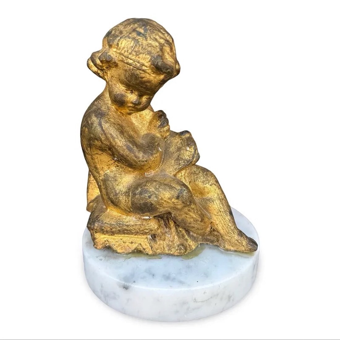 Italian Gilt Bronze Putti Cherub: Italian gilt bronze angel sculpture mounted on white marble base. Approx Dimensions: 5.75H x 4W x 4D inches