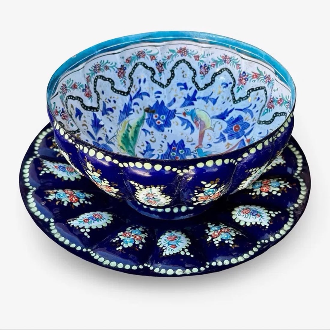 Persian Minakari Bowl Plate Set: Persian-style Minakari bowl and underplate with cobalt blue ground and floral enamel decoration Approx. Dimensions Plate: 1.5H x 9W × 9D inches Approx. Dimensions Bowl: 4H x 7W × 7D inches