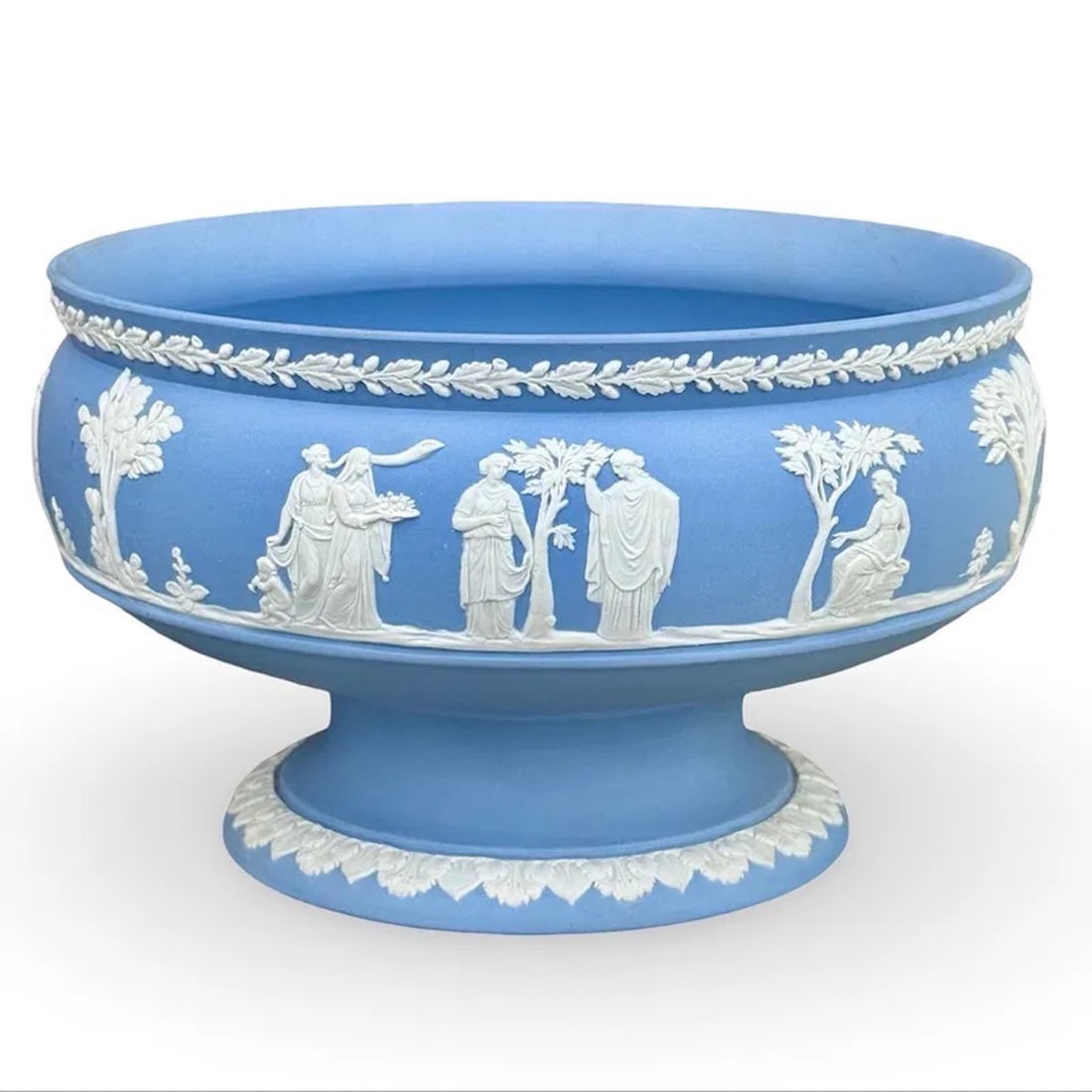 Wedgwood Blue Jasperware Fruit Bowl: Wedgwood blue Jasperware footed fruit bowl with white neoclassical bas-relief decoration. Marked on base. Approx. Dimensions: 5.25H x 8.5W × 8.5D inches