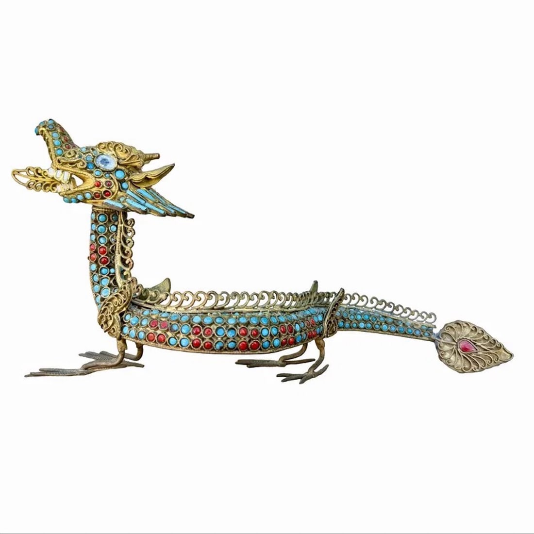 Chinese Filigree Dragon Figure: Metal filigree jeweled dragon sculpture inlaid with turquoise and coral stones. Head is removable. Dimensions: 4H x 8W x 2D inches