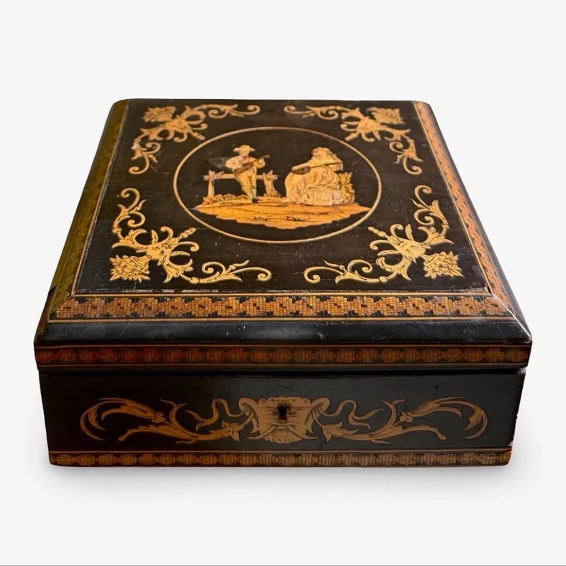 Sorrento Marquetry Inlaid Box: Italian Sorrento ware marquetry casket with inlaid wood decoration, hinged lid, and lined interior. Dimensions: 3H x 6.75W x 6.75D inches