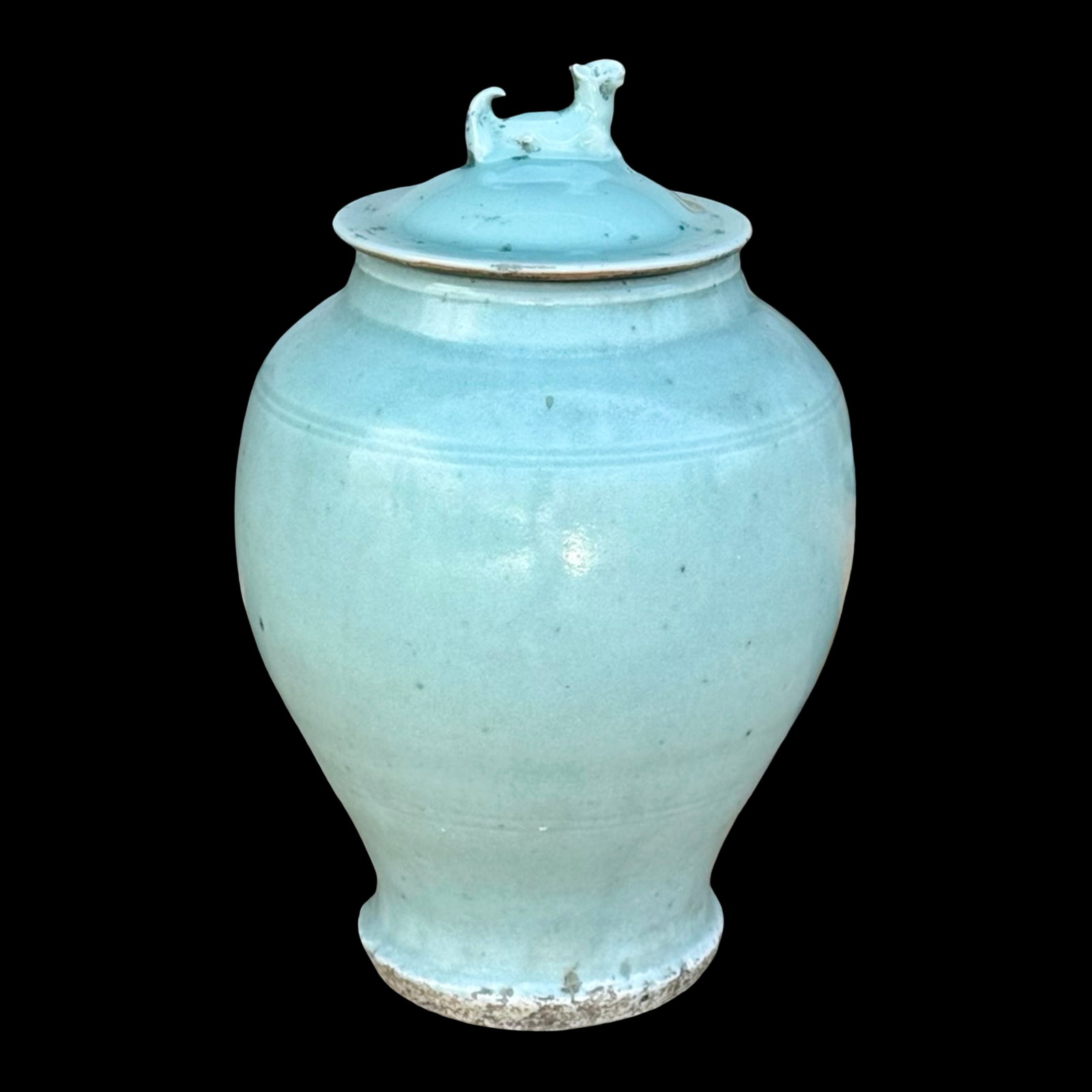 Chinese Celadon Foo Dog Ginger Jar: Chinese celadon-glazed ginger jar with foo dog finial on lid.