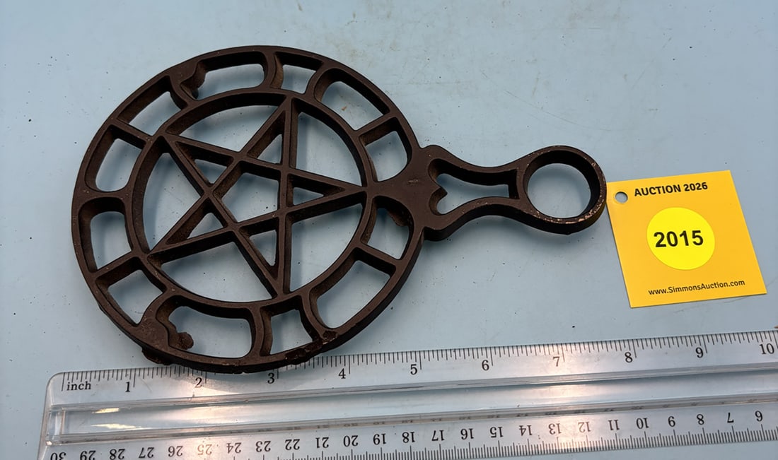 J.Z.H. 8'' x 5'' trivet w/ three feet. Star in center: J.Z.H. 8'' x 5'' trivet w/ three feet. Star in center