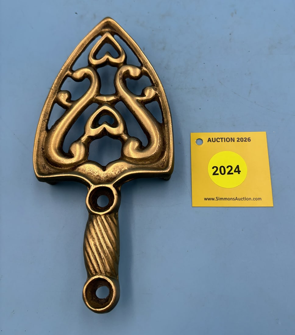 Hearts & Urn or Double hearts in Scrolls 8'' x 3 1/2'' w/ three feet trivet. On rearside marked ...: Hearts & Urn or Double hearts in Scrolls 8'' x 3 1/2'' w/ three feet trivet. On rearside marked with number 82
