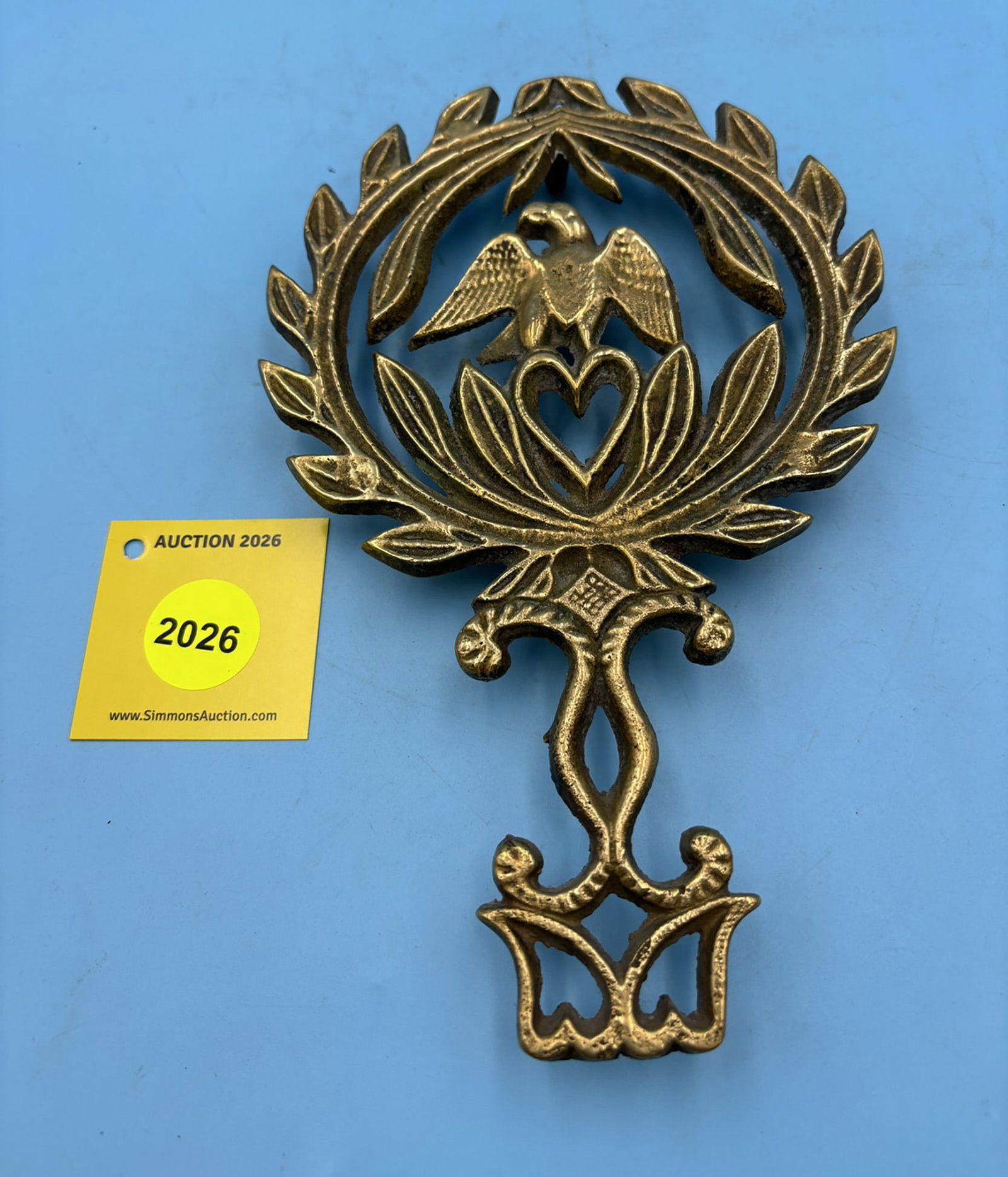 Brass Eagle with long handle 9'' x 5 1/2'' w/ four feet trivet . Unsigned (1 of 2)