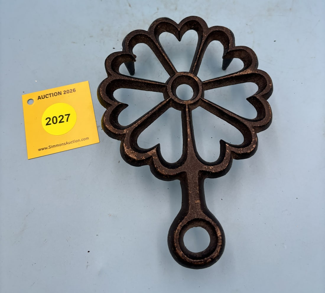 Seven Hearts 6 5/8''x 4 5/8'' w/ three feet trivet. Marked 5-23 on the rearside (1 of 2)