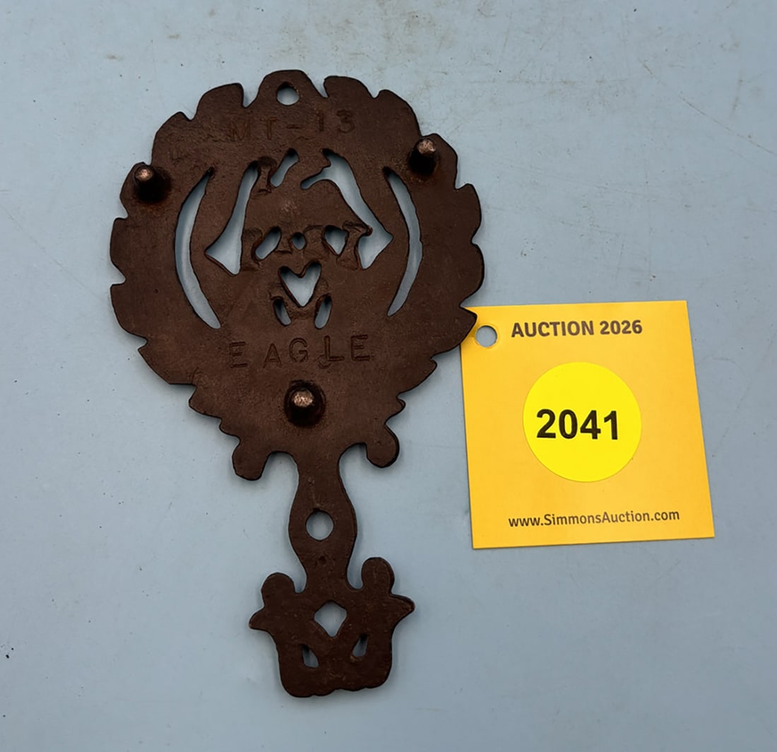 Unmarked mini eagle 5 1/4'' x 3 1/8'' w/ three feet trivet. On reverse marked "MT-13 Eagle". - 2