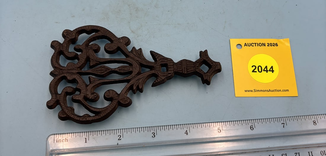 Wilton Mini Butterfly 5 1/4'' x 3'' w/ three feet trivet. On reverse marked with Wilton (1 of 2)