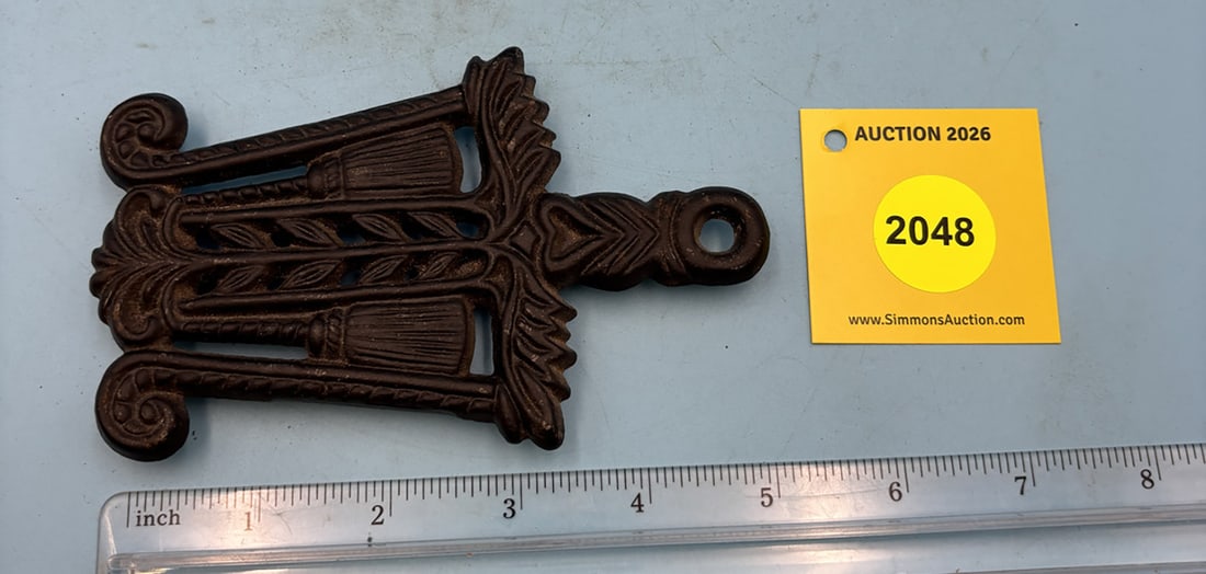 Mini Grain & Tassel 5 1/4'' x 3 3/8'' w/ three feet trivet. On reverse marked with "Grain & Tasse... (1 of 2)