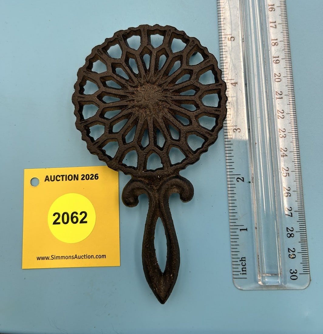 Wilton Mini Handled Lantz 5 1/2'' x 3 1/8'' w/ three feet trivet. On reverse marked with Wilton (1 of 2)