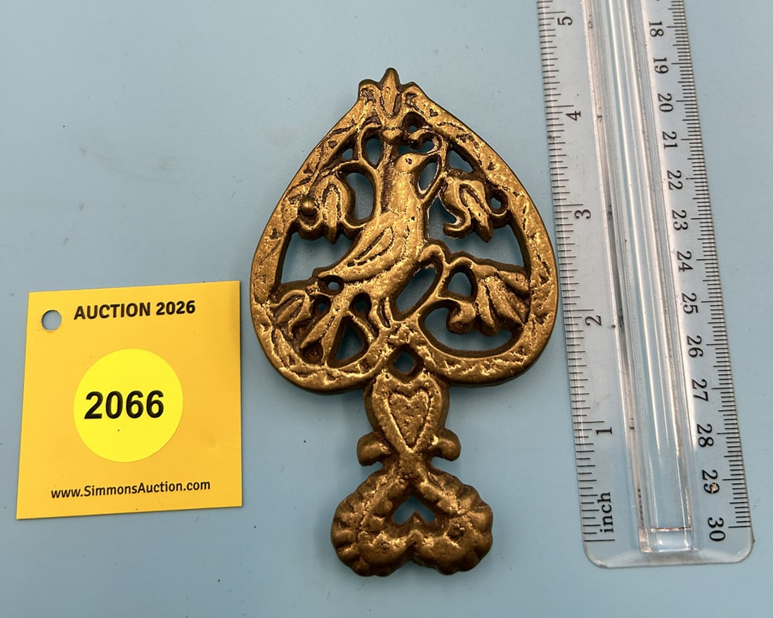 Unmarked Brass Distelfink 4 1/2'' x 2 7/8'' w/ three feet trivet. (1 of 2)