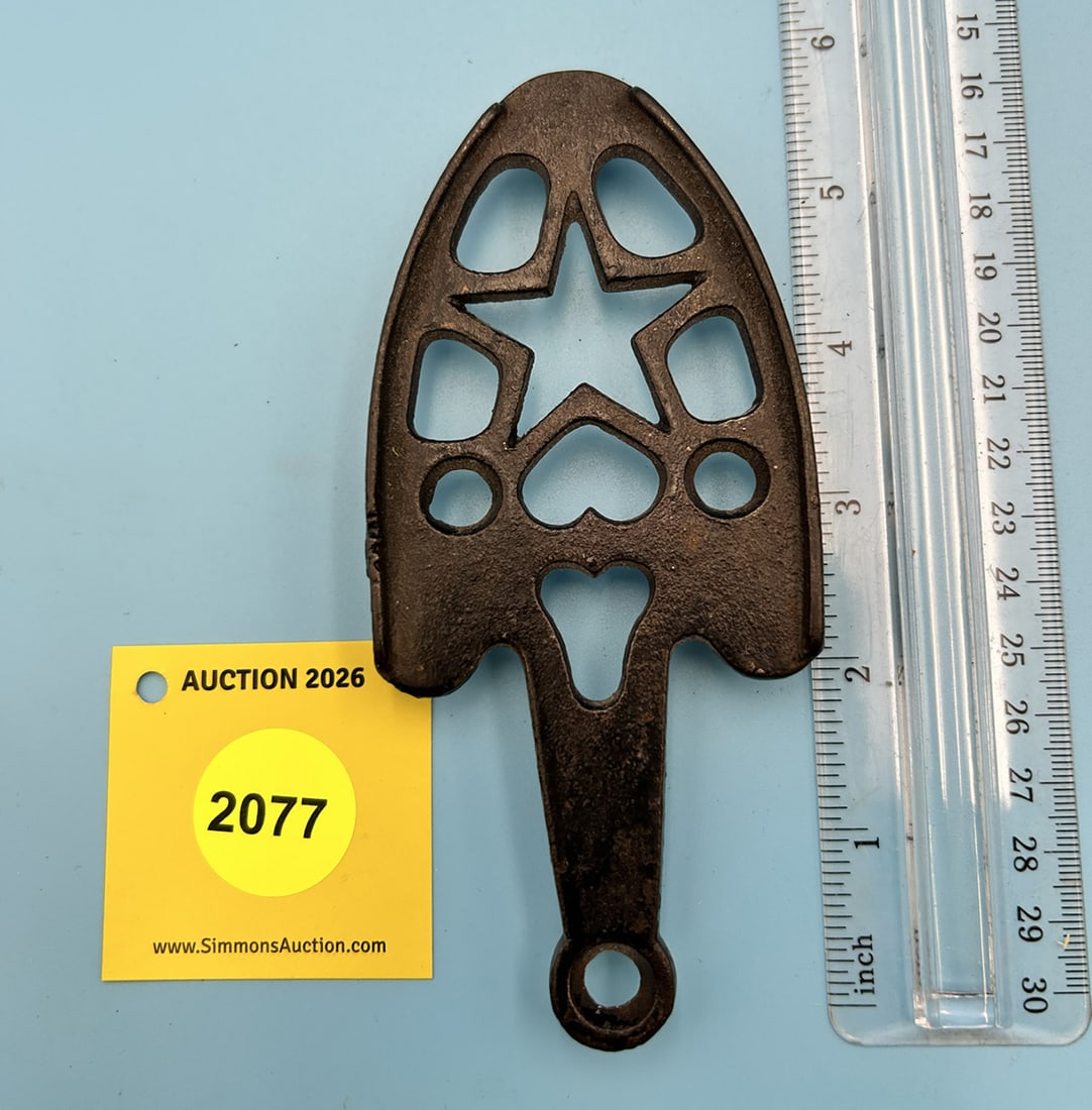 Unsigned Star with Holes 5 1/2'' x 2 1/2'' w/ three feet trivet. With two iron guide rails (1 of 2)