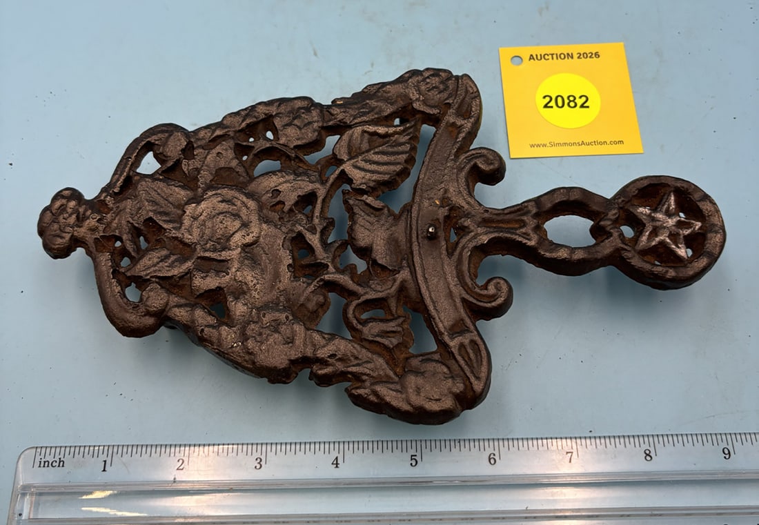 Unsigned Ornate Floral 9'' x 5'' w/ four legs trivet: Unsigned Ornate Floral 9'' x 5'' w/ four legs trivet