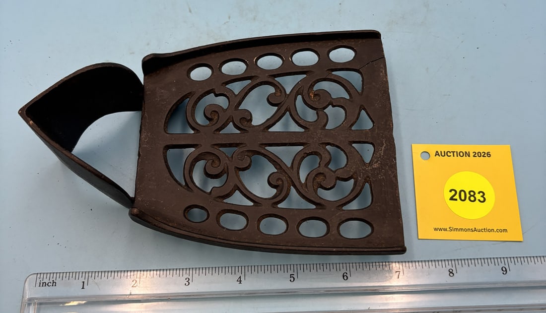 Pease 7'' x 4 1/2'' w/ two feet. Hinged front guide and 1/4'' side rails trivet. On reverse PAT.D...: Pease 7'' x 4 1/2'' w/ two feet. Hinged front guide and 1/4'' side rails trivet. On reverse PAT.D AUG 23 1904. Companion stand to the Pease combination charcoal iron/flutter.trivet is cracked