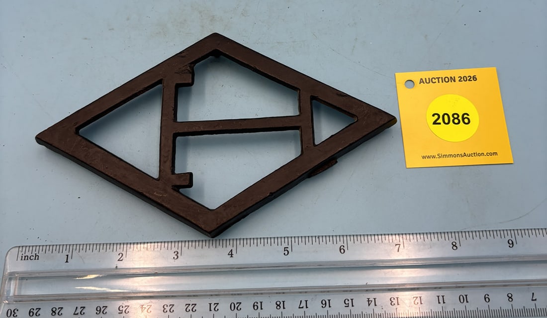 Taylor T 6 7/8'' x 4 1/8'' w/ four feet trivet. (1 of 1)