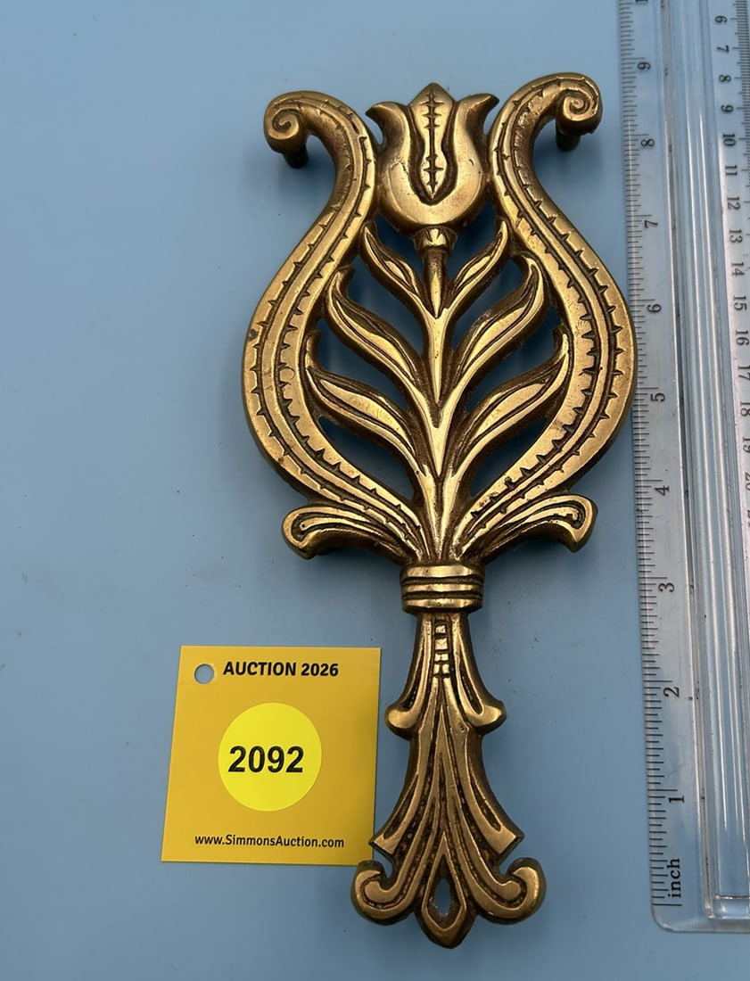 Brass Wilton Dutch Tulip 8 1/2'' x 4'' w/ four feet trievet. On reverse marked with Wilton (1 of 2)