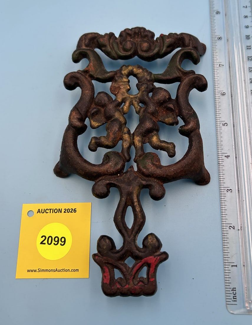 Unsigned Cupid 7 1/2'' x 4'' w/ four legs trivet. On face slight accented with gold, red, and green (1 of 2)