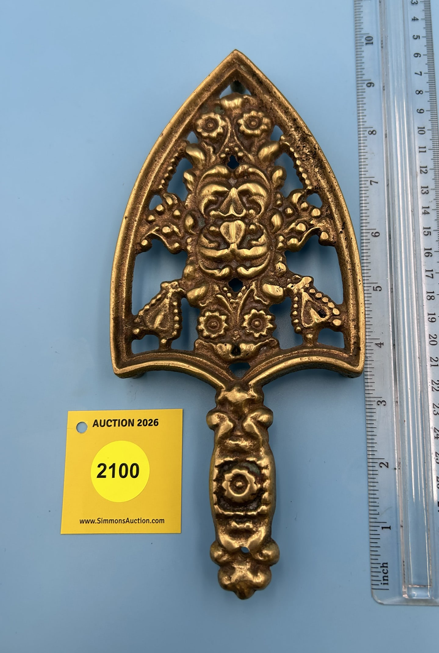 Brass Unmarked Hearts and Flowers 9'' x 4'' w/ three feet trievet. (1 of 2)