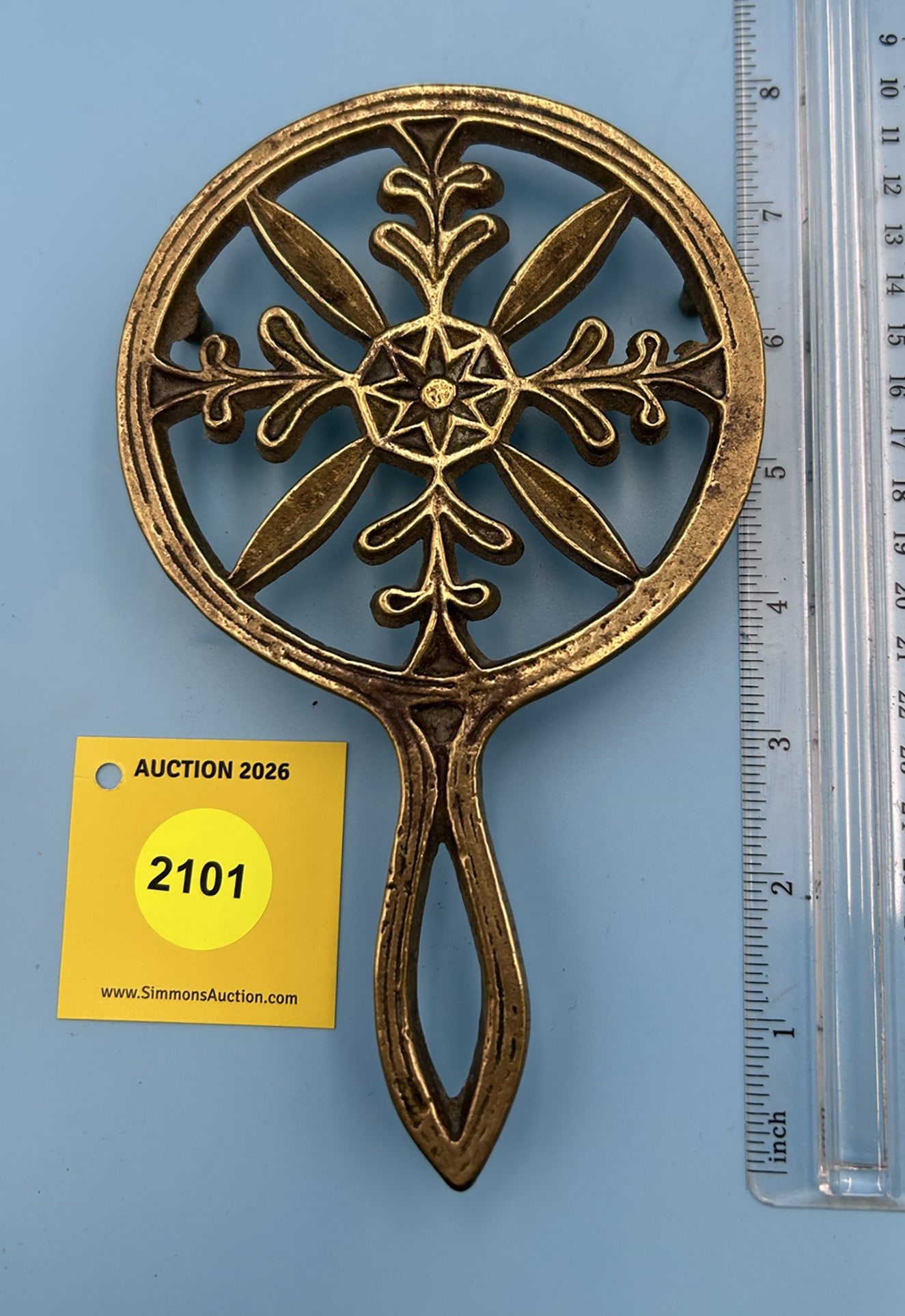 Brass Unmarked Snowflake 7 1/2'' x 4 1/2'' w/ three feet trivet. (1 of 2)