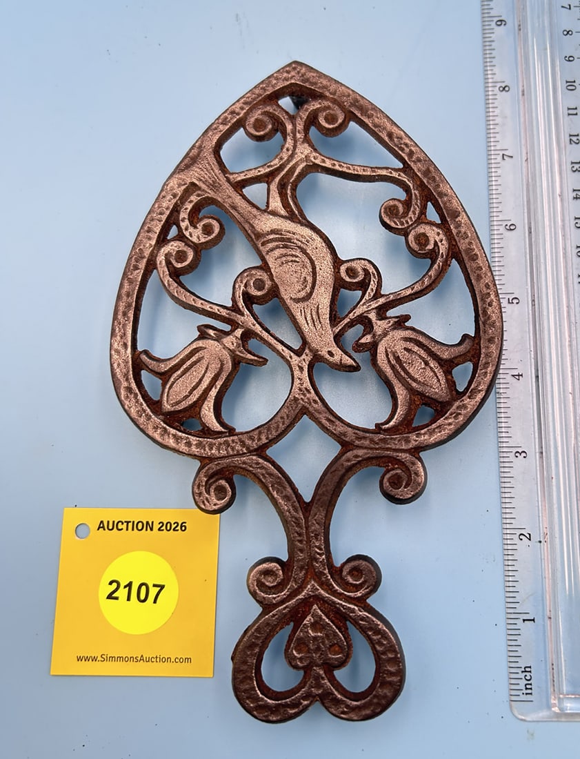 Unsigned Distelfink 8'' x 4 3/4'' w/ three feet trivet. On reverse marked with number 48 (1 of 2)