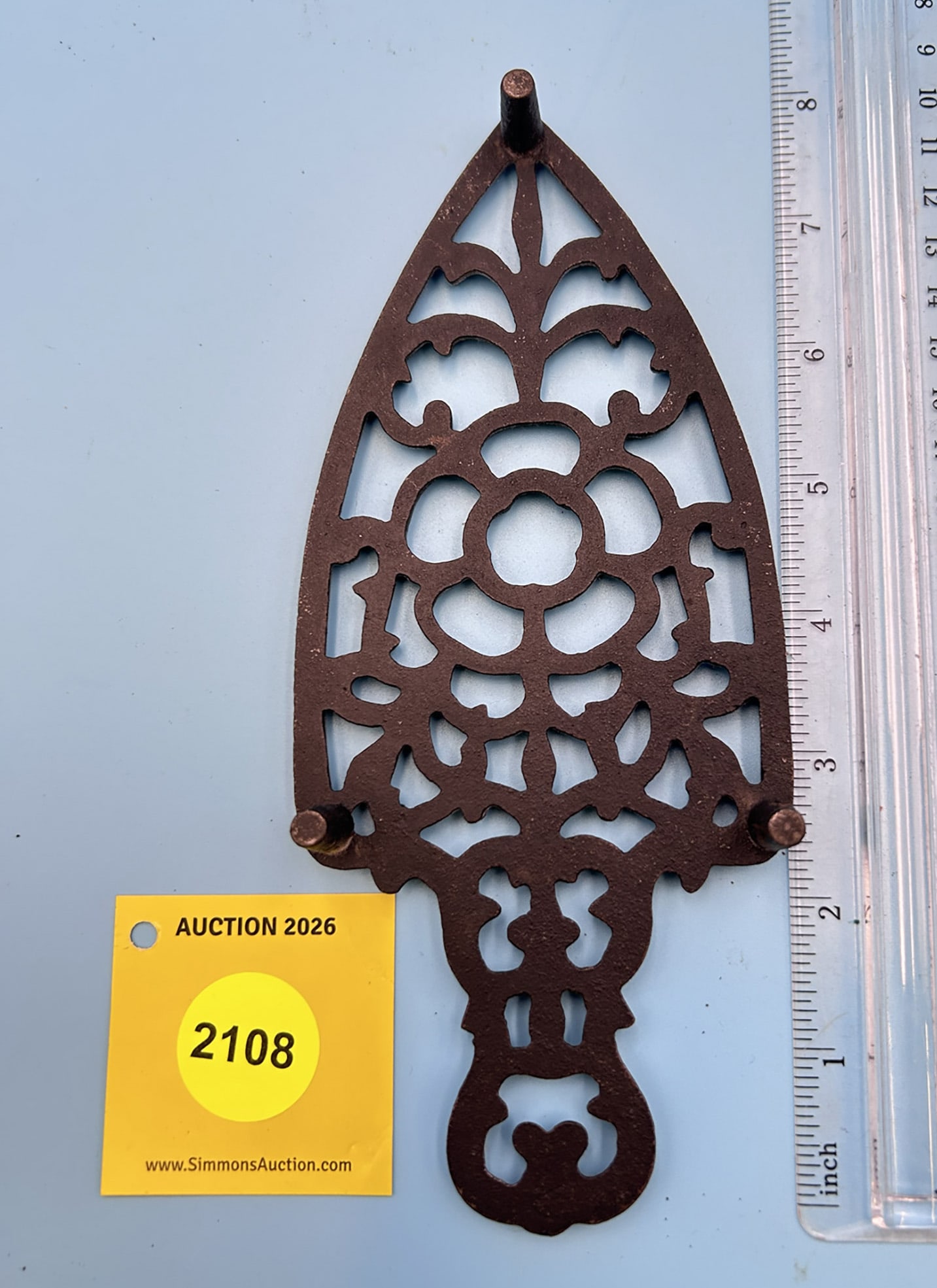 Unmarked Lacy 8'' x 3 1/2'' w/ three feet trivet. - 2