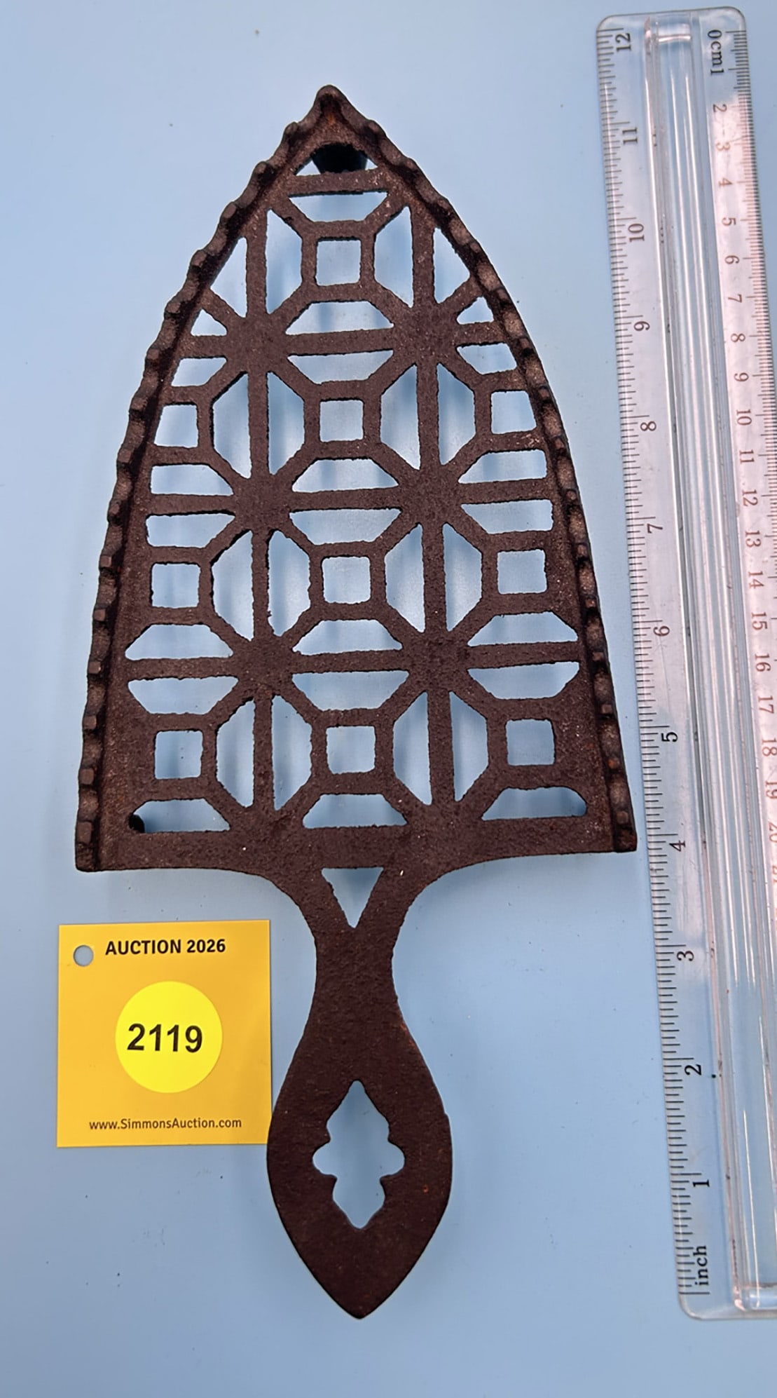 Unmarked Kenrick No. 4 style 10 3/4'' x 4 3/4'' w/ three feet trivet. Scalloped rim side iron guide: Unmarked Kenrick No. 4 style 10 3/4'' x 4 3/4'' w/ three feet trivet. Scalloped rim side iron guide rails