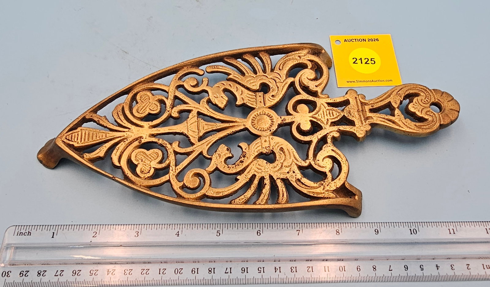 Unmarked Brass dragons 11'' x 5'' w/ three 3/4'' splayed feet trivet. (1 of 2)