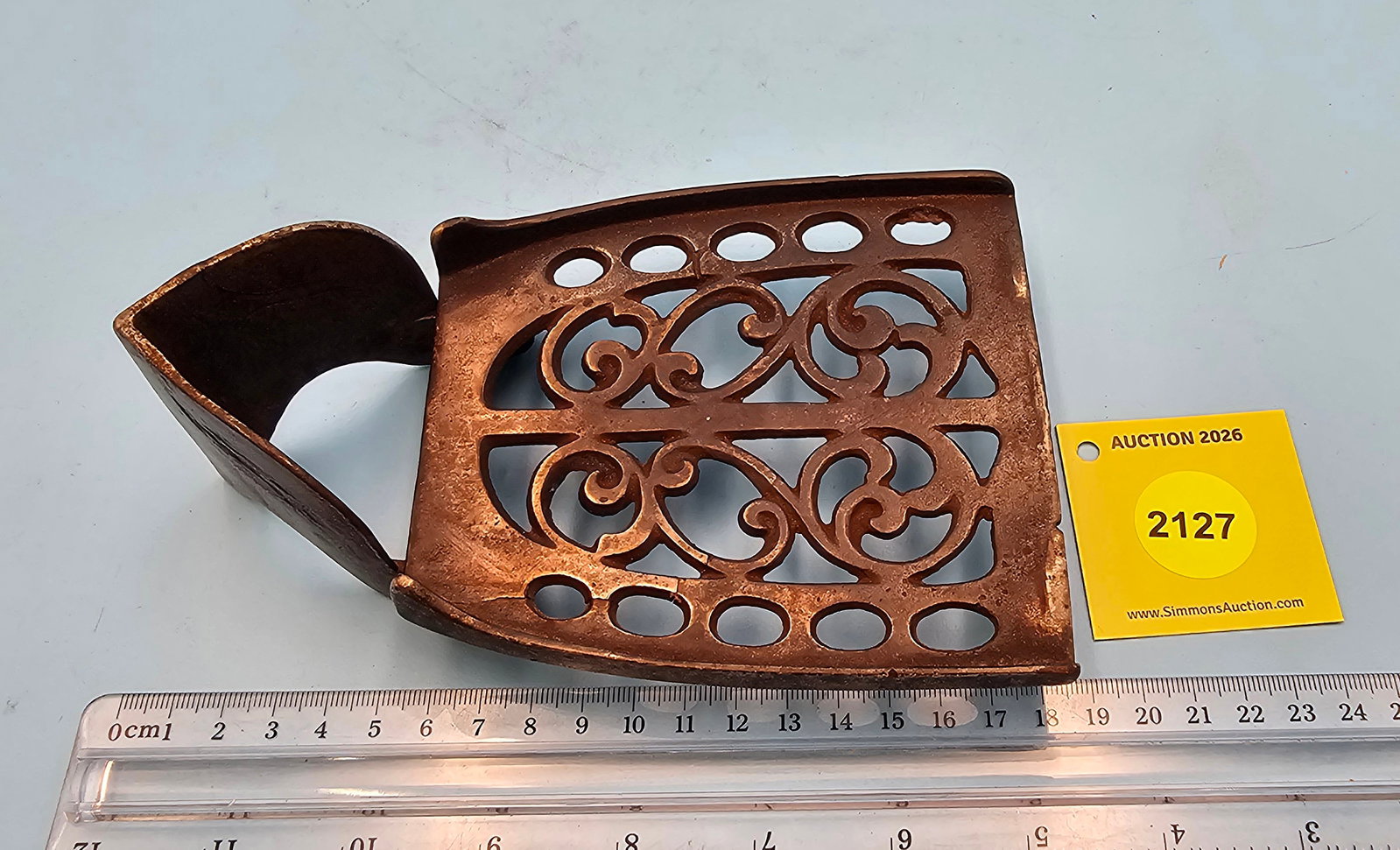 Pease 7'' x 4 1/2'' w/ two feet. Hinged front guide and 1/4'' side rails trivet. On reverse PAT.D...: Pease 7'' x 4 1/2'' w/ two feet. Hinged front guide and 1/4'' side rails trivet. On reverse PAT.D AUG 23 1904. Companion stand to the Pease combination charcoal iron/flutter.trivet is cracked