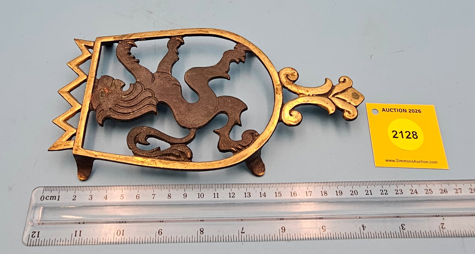 Nordia Dayagi Brass lion 8 1/2'' x 4 1/2'' w/ four feet trivet. On reverse marked with Nordia logo (1 of 2)