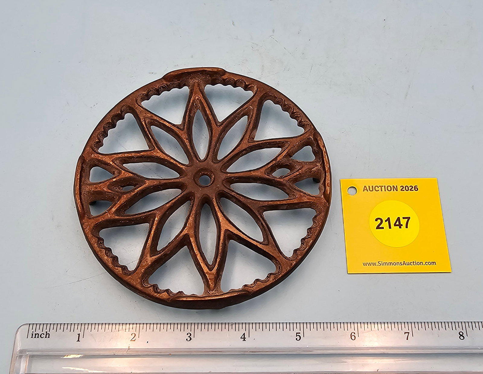 Round cast iron trivet, diameter 5", height 3/4": Round cast iron trivet, diameter 5", height 3/4"
