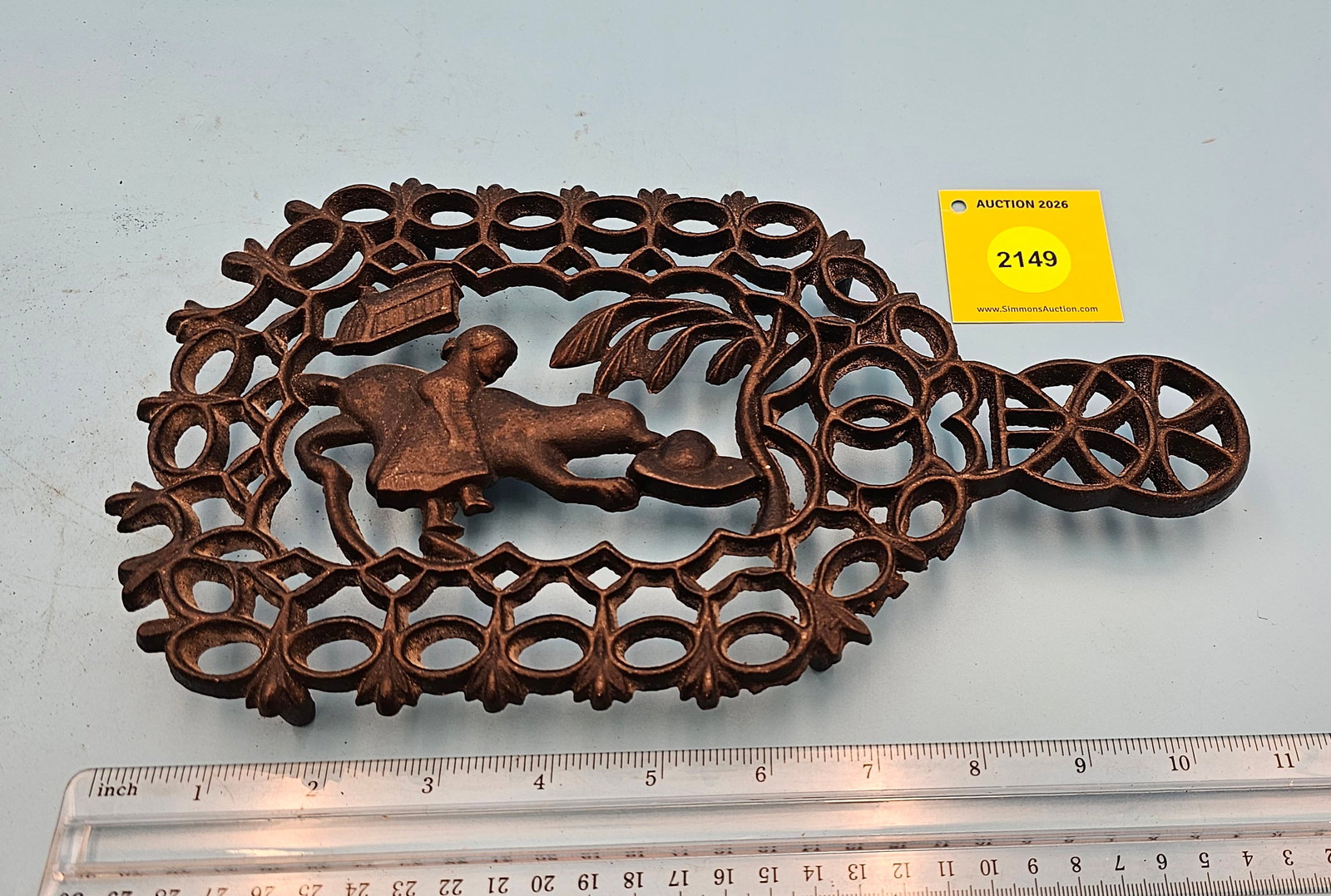 Cast iron trivet, Red Riding Hood 11 x 6 1/4 x 1" believed to be a reproduction because of backco... (1 of 2)