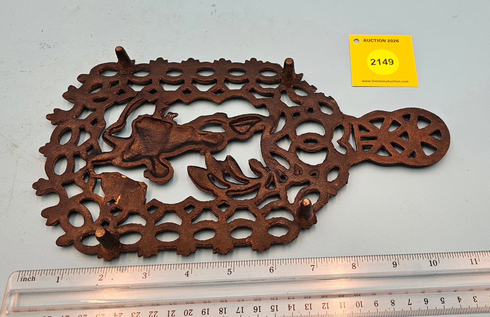 Cast iron trivet, Red Riding Hood 11 x 6 1/4 x 1" believed to be a reproduction because of backco... - 2