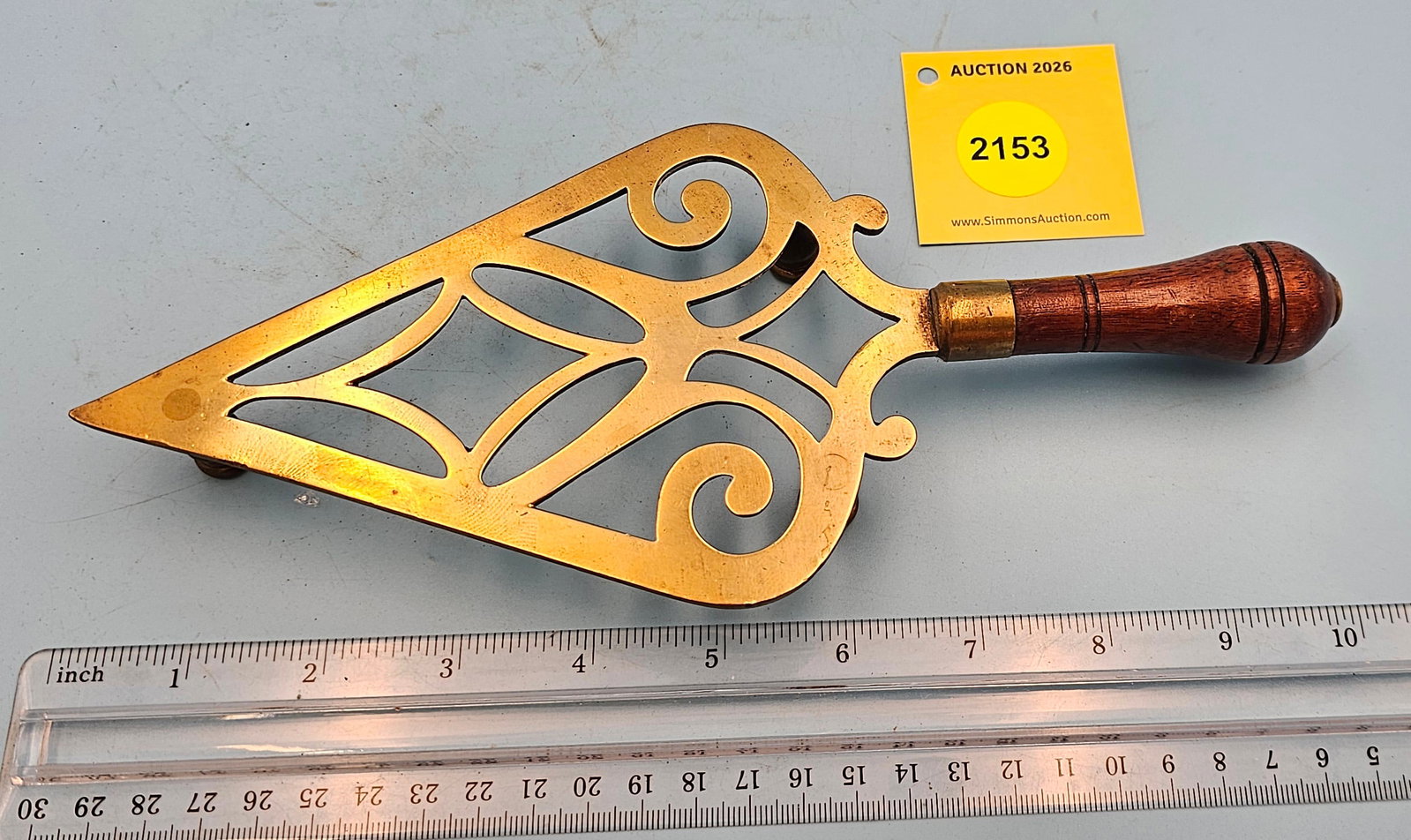Spade brass trivet w/wood handle, 9 3/4 x 4 x 1": Spade brass trivet w/wood handle, 9 3/4 x 4 x 1"