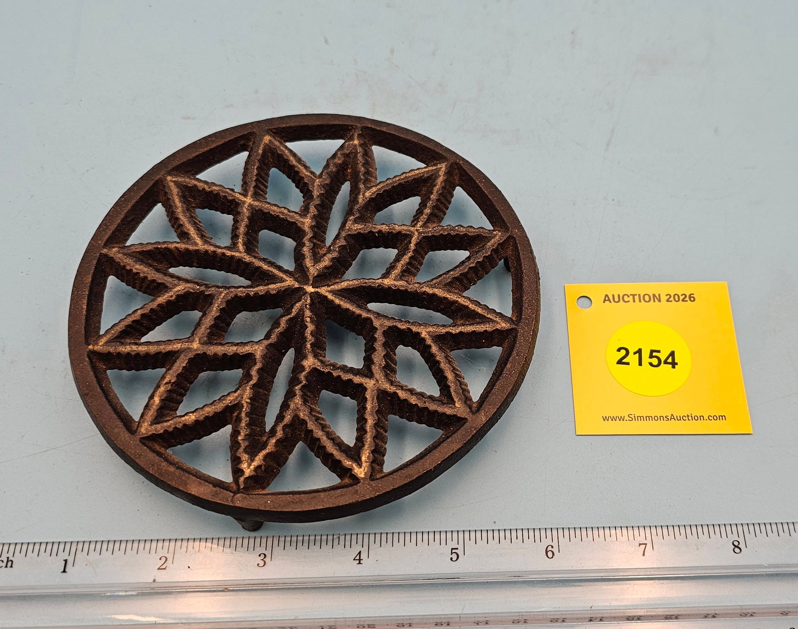 Round cast iron trivet, diameter 5 1/4" height 3/4": Round cast iron trivet, diameter 5 1/4" height 3/4"