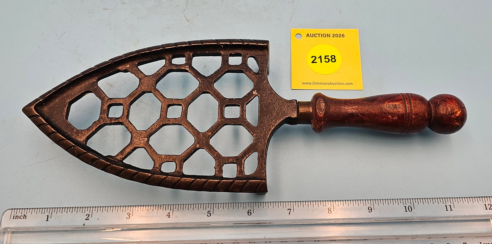 Spade trivet w/geometric design, marked No 105 on back, w/wood handle 11 x 4 1/4 x 1 1/4" (1 of 2)