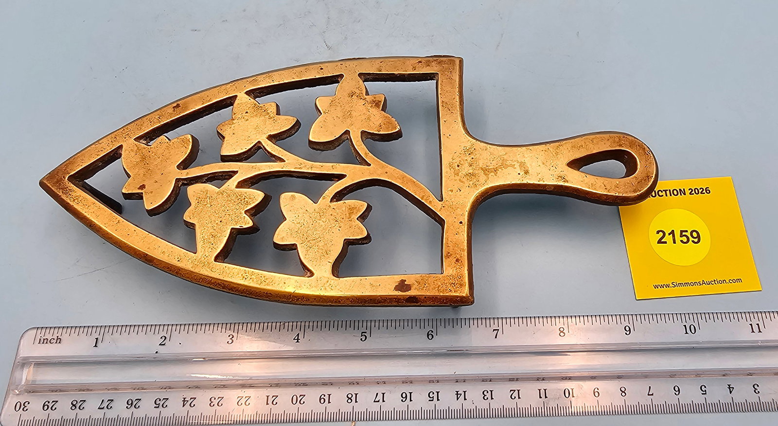 Brass trivet w/leaf design 9 1/2 x 4 1/4 x 1 1/8" (1 of 2)