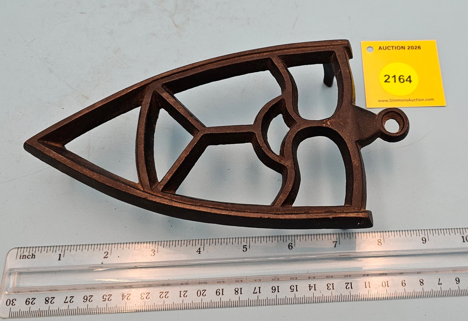 Cast iron trivet, geometric design, 8 1/4 x 4 1/2 x 1 5/8": Cast iron trivet, geometric design, 8 1/4 x 4 1/2 x 1 5/8"