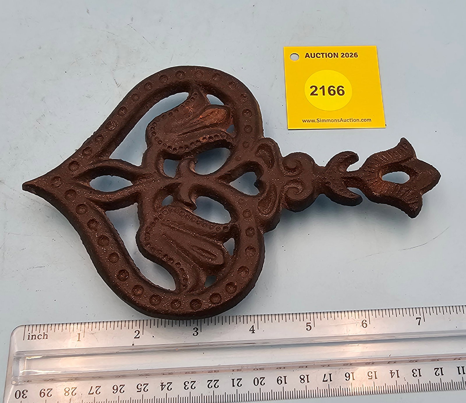 Cast iron trivet, "Canada Forge" on back, 7 1/2 x 5 x 3/4" (1 of 2)