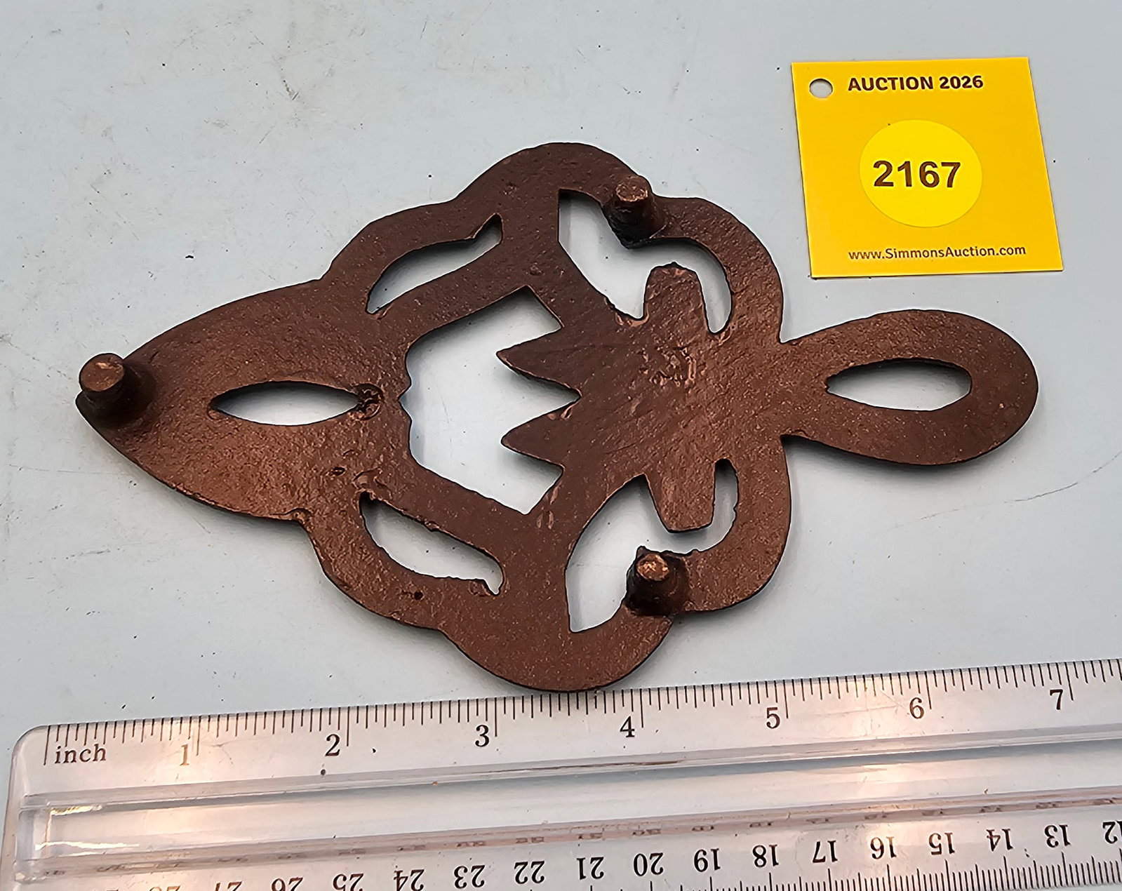 Cast iron trivet, 7 x 4 1/4 x 5/8" - 2