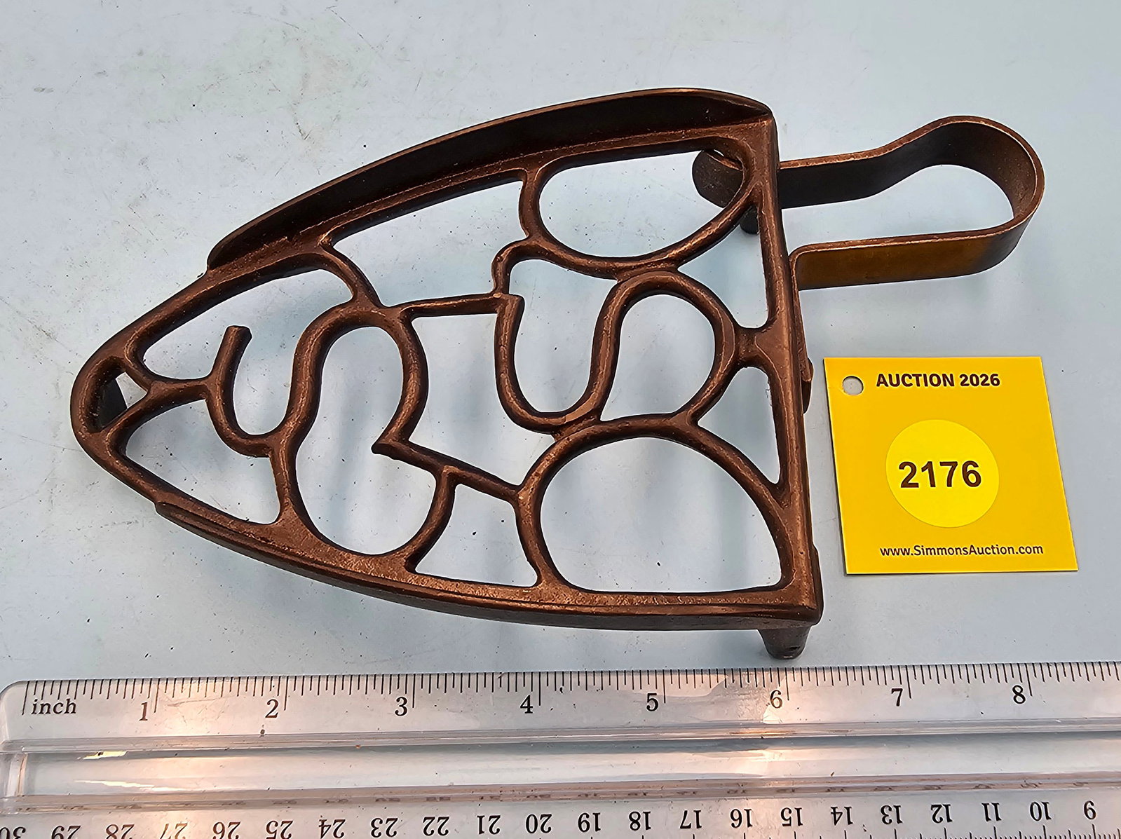 Tilted trivet, "S" design, movable handle, 8 1/4 x 4 1/4 x 1 1/4": Tilted trivet, "S" design, movable handle, 8 1/4 x 4 1/4 x 1 1/4"