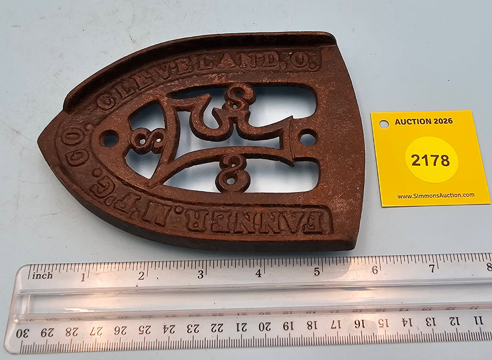 Iron trivet, Fanner. Mfg. Co. Cleveland, O. 5 7/8 x 4 1/4 x 1/2" (1 of 2)