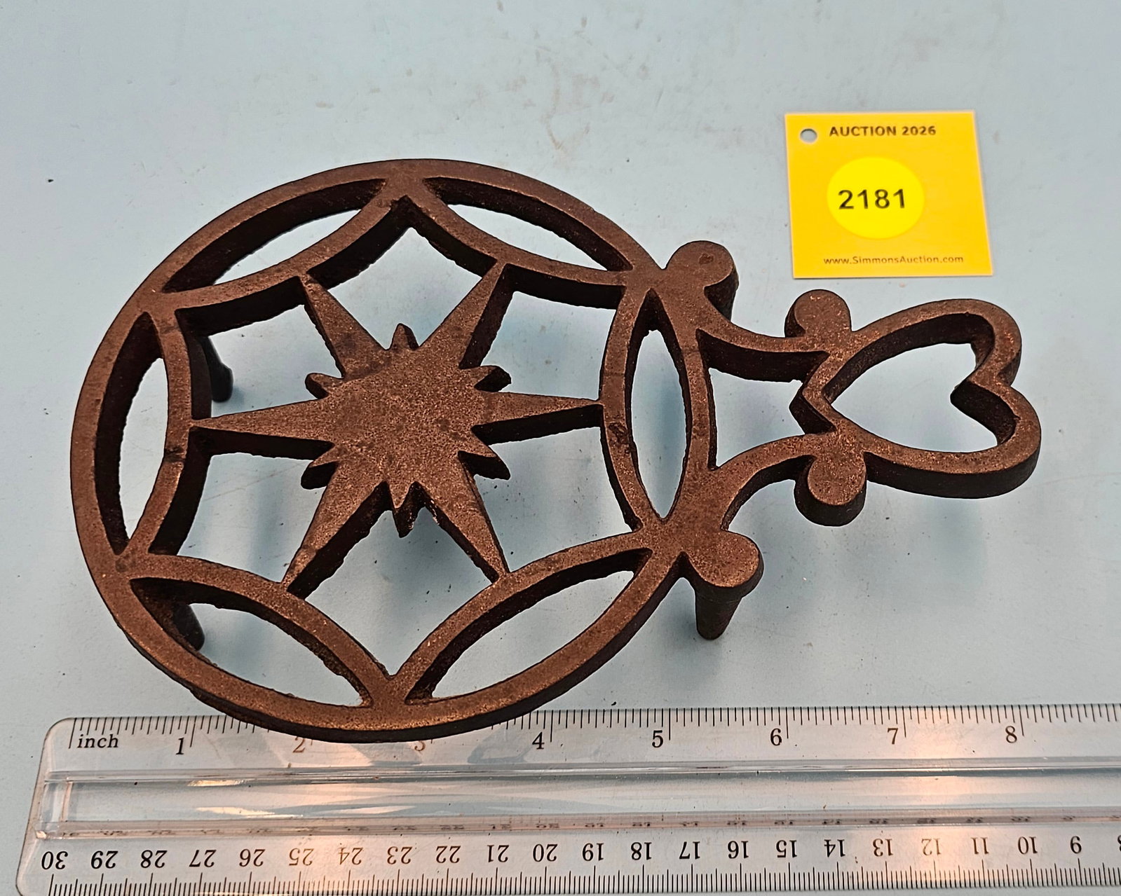 Cast iron, round trivet w/handle 7 3/4 x 5 1/8 x 1 5/8" (1 of 2)