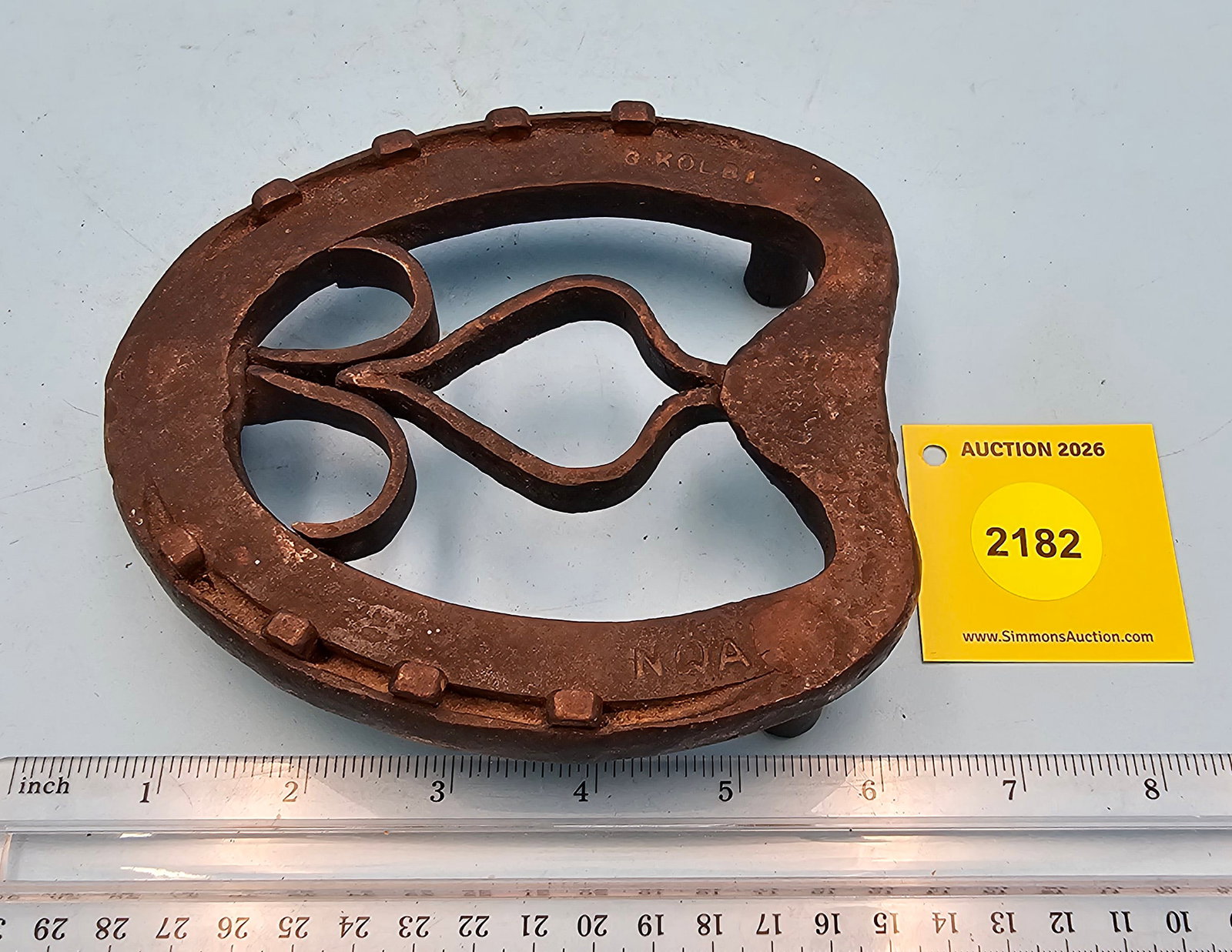 Hand forged trivet, marked NWA, G Kolr on top, 5 3/4 x 5 1/8 x 1 1/4" (1 of 2)