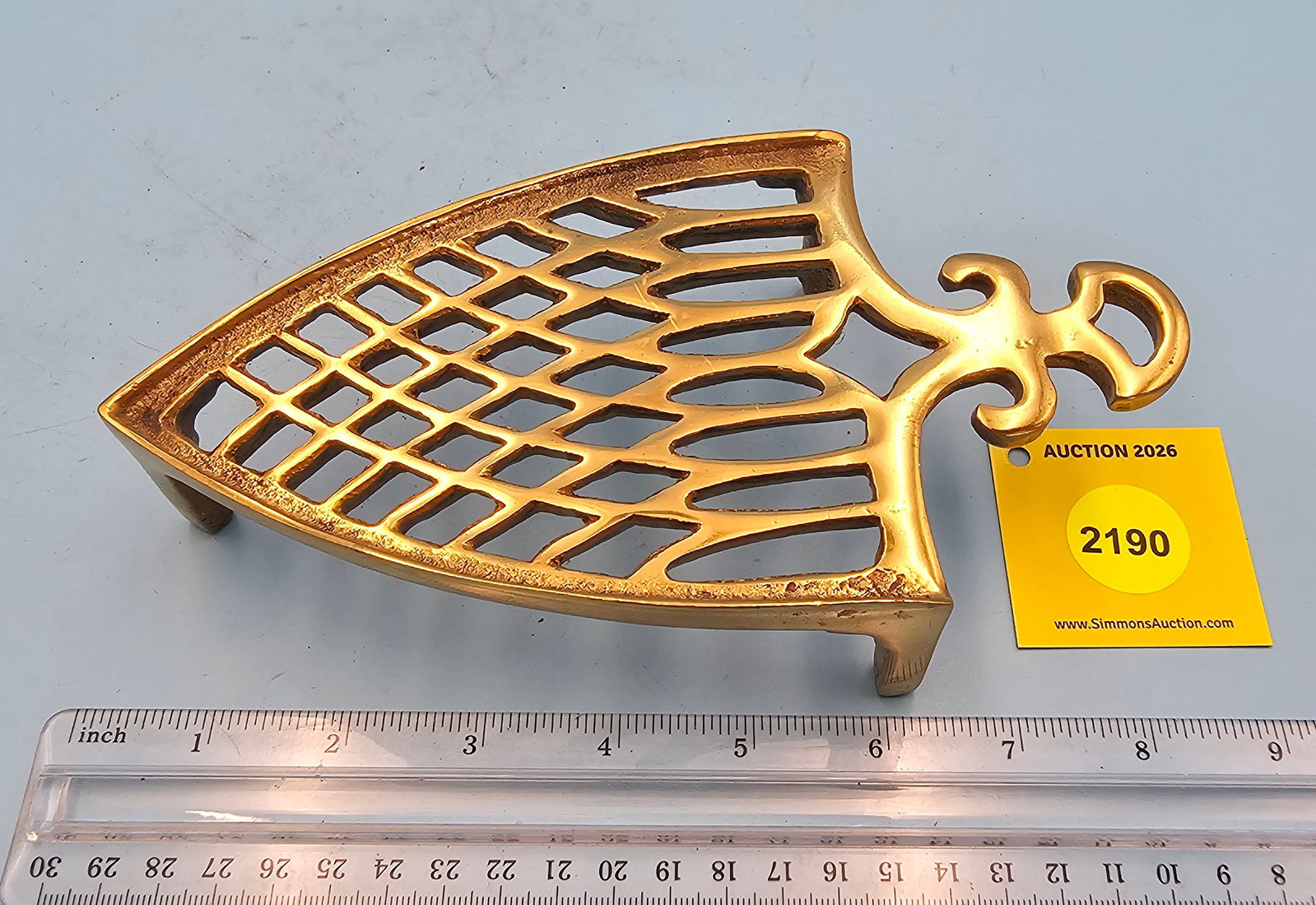 Brass trivet, geometric design, 7 3/4 x 4 1/8 x 1 3/4" (1 of 2)
