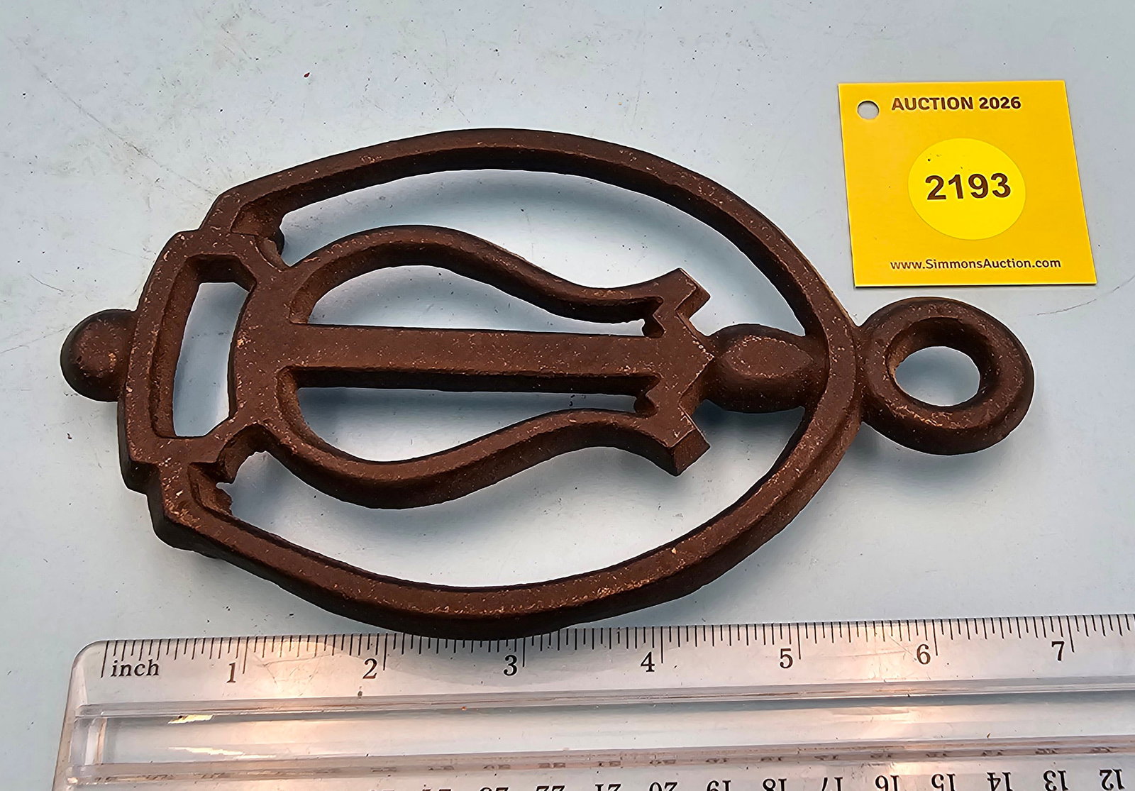 Cast iron trivet, no markings, 7 1/4 x 4 1/4 x 3/4" (1 of 2)