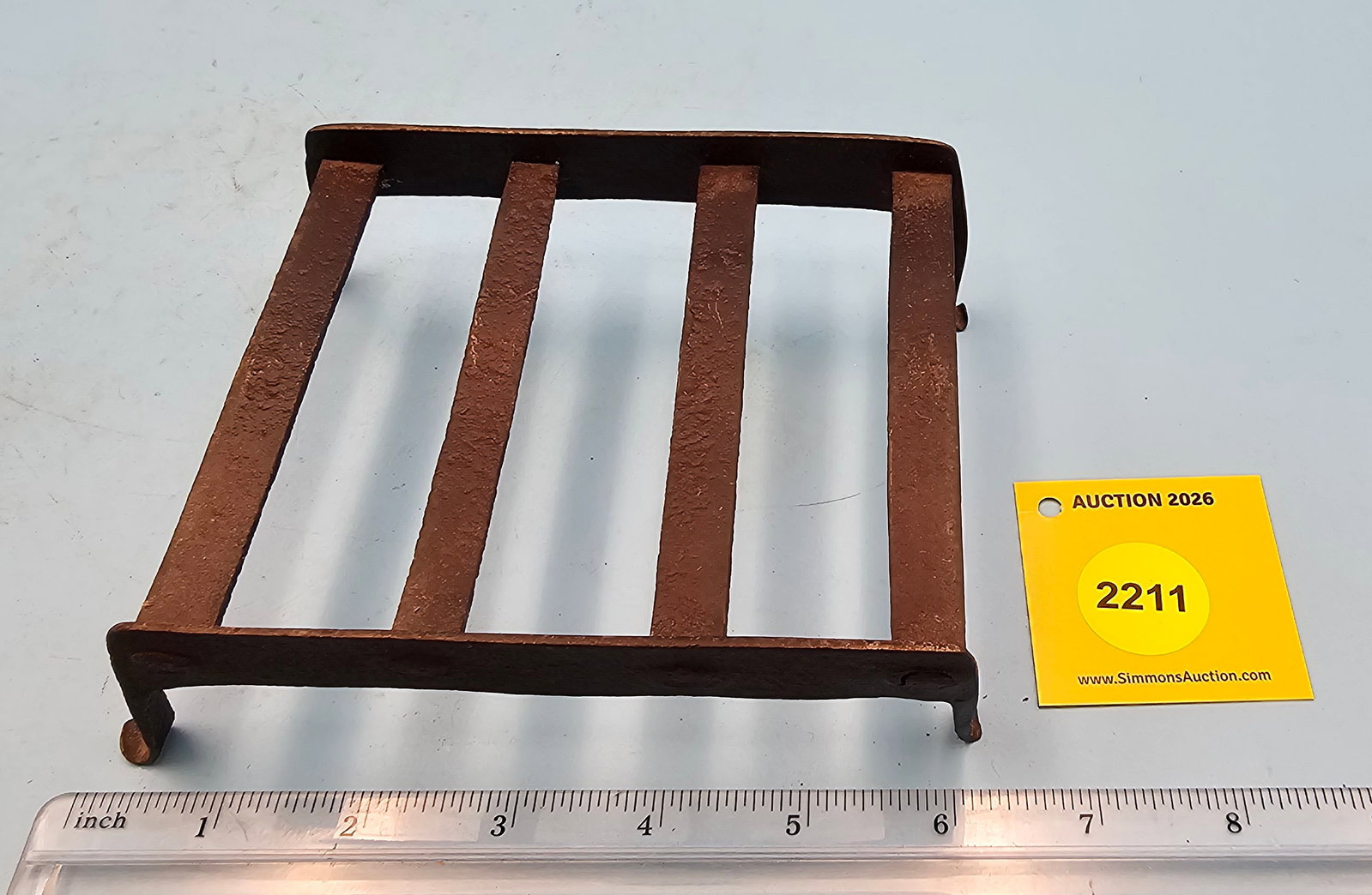 Cast iron trivet, 6 x 4 3/4 x 1 3/4": Cast iron trivet, 6 x 4 3/4 x 1 3/4"