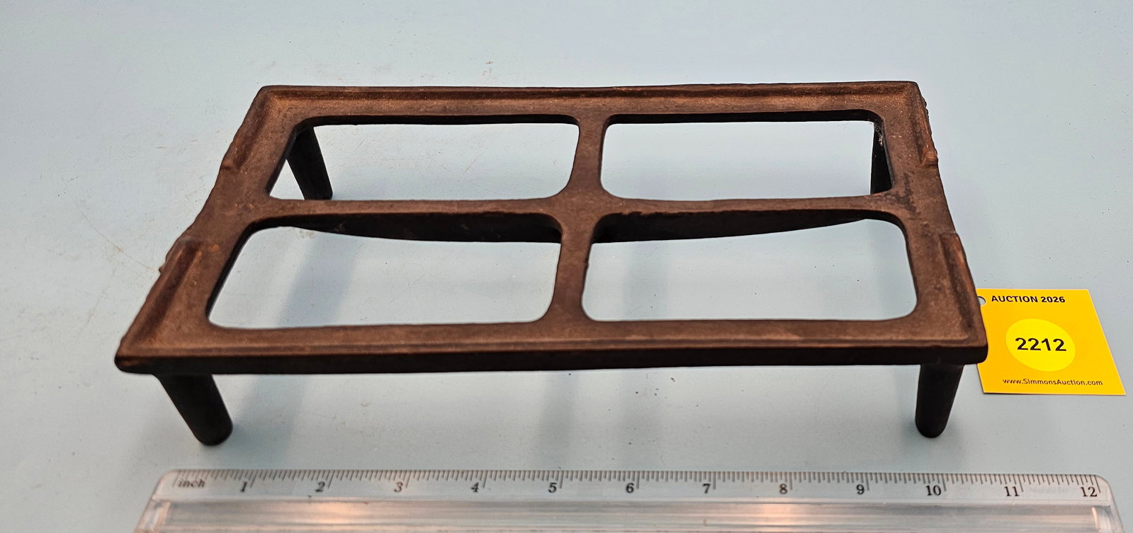 Cast iron trivet, marked "53" on bottom, 10 1/2 x 5 1/2 x 2 1/8" (1 of 2)